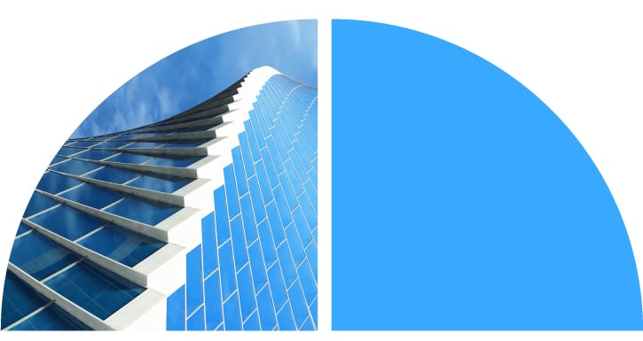 Curved building made of blue windows. Curved building made of blue windows.