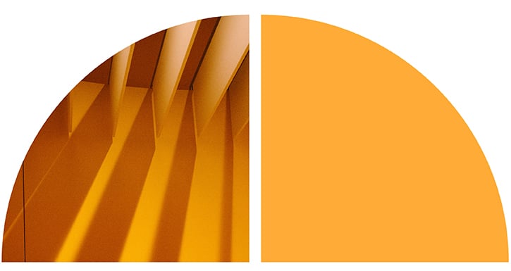 Abstract graphic split in two, with golden architectural fins on the left and a solid orange field on the right.