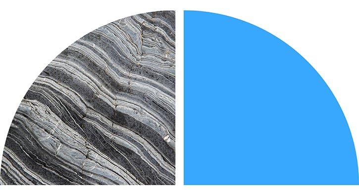 Layered stone texture and solid blue shape.