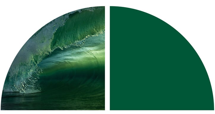 A blue and green wave crashing 