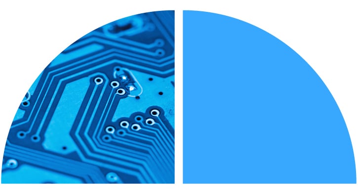 An up-close view of a circuit board, set in blue lighting. An up-close view of a circuit board, set in blue lighting.