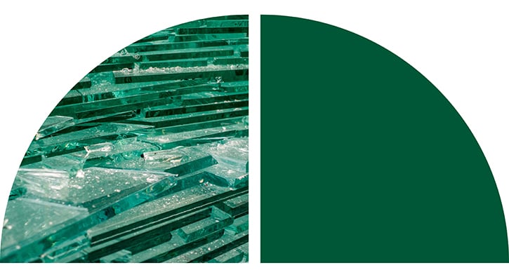 Abstract green graphic with a textured, fractured pattern on the left and a solid dark green geometric shape on the right.