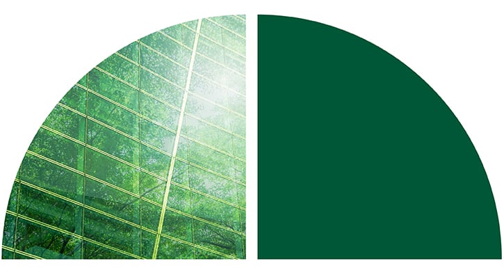 Two adjacent semi-circles: the left one has a greenish hue with a tree-reflection pattern resembling glass, and the right one is solid dark green.