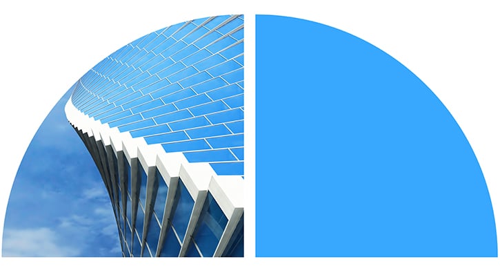 Stylized semicircle graphic combining a modern glass office building façade with a solid blue geometric shape.